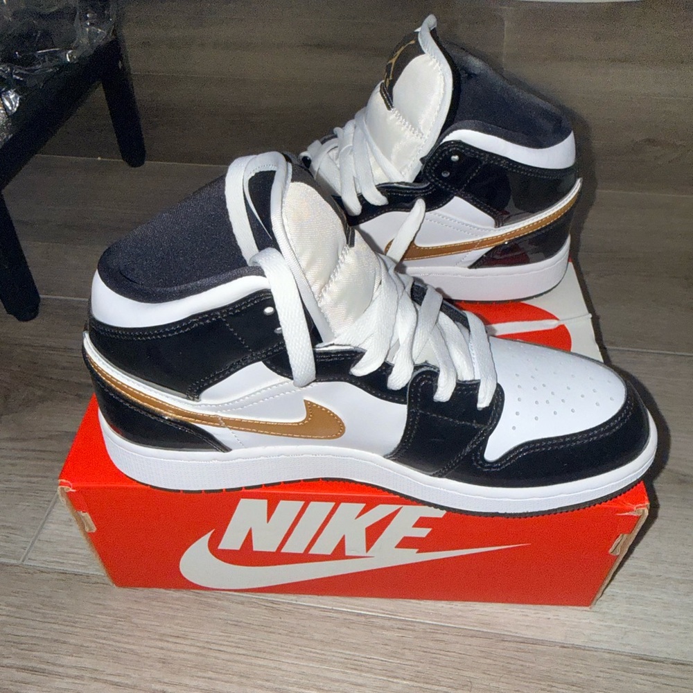 Nike High-Top Sneakers in Black, White, and Gold